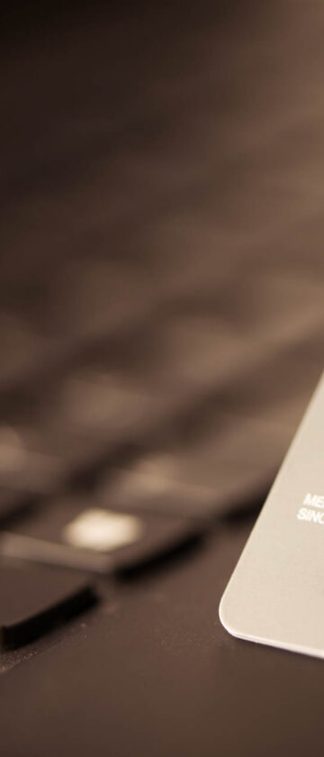 Credit card on laptop for online payment or shopping concept