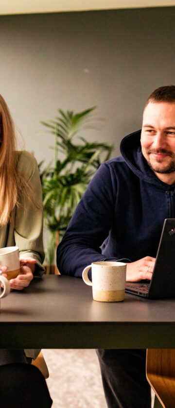 IT nearshore team work together in the office.