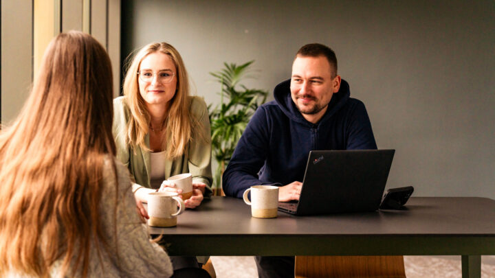 IT nearshore team work together in the office.