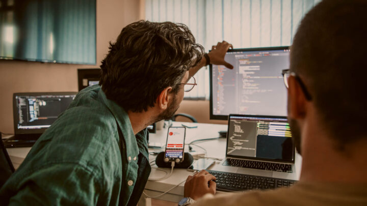 IT consultants working on cloud migration.