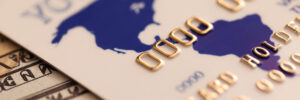 Credit card and banknotes representing digital and cash payments