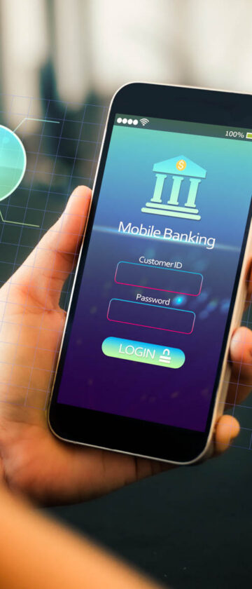 Close-up of hands using mobile phone to make transfer via cell phone