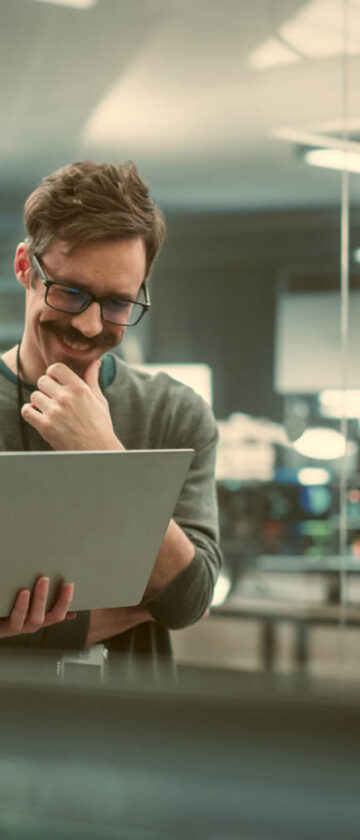 Engineers working together on a laptop
