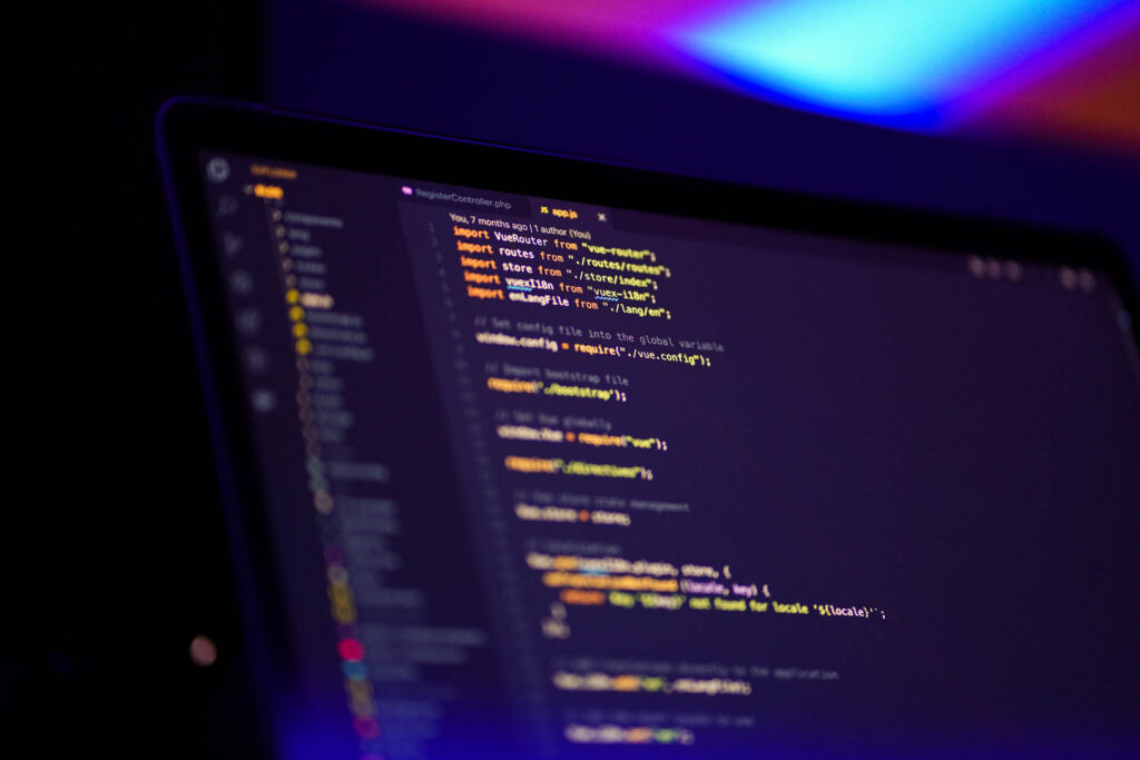 Computer screen displaying data analytics and programming code